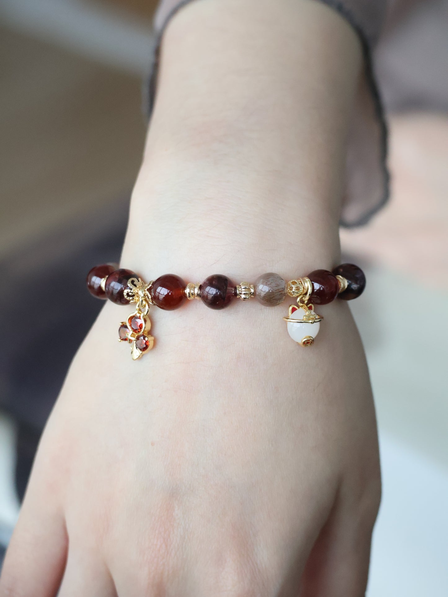 *Instocks* - Crimson Blessing - 8mm Fire Quartz, Garnet, Black Gold Skeletal Sunstone, 招财猫 Cat Charm, Red 3-Leaf Clover & 福 Charm (Elastic) Gold