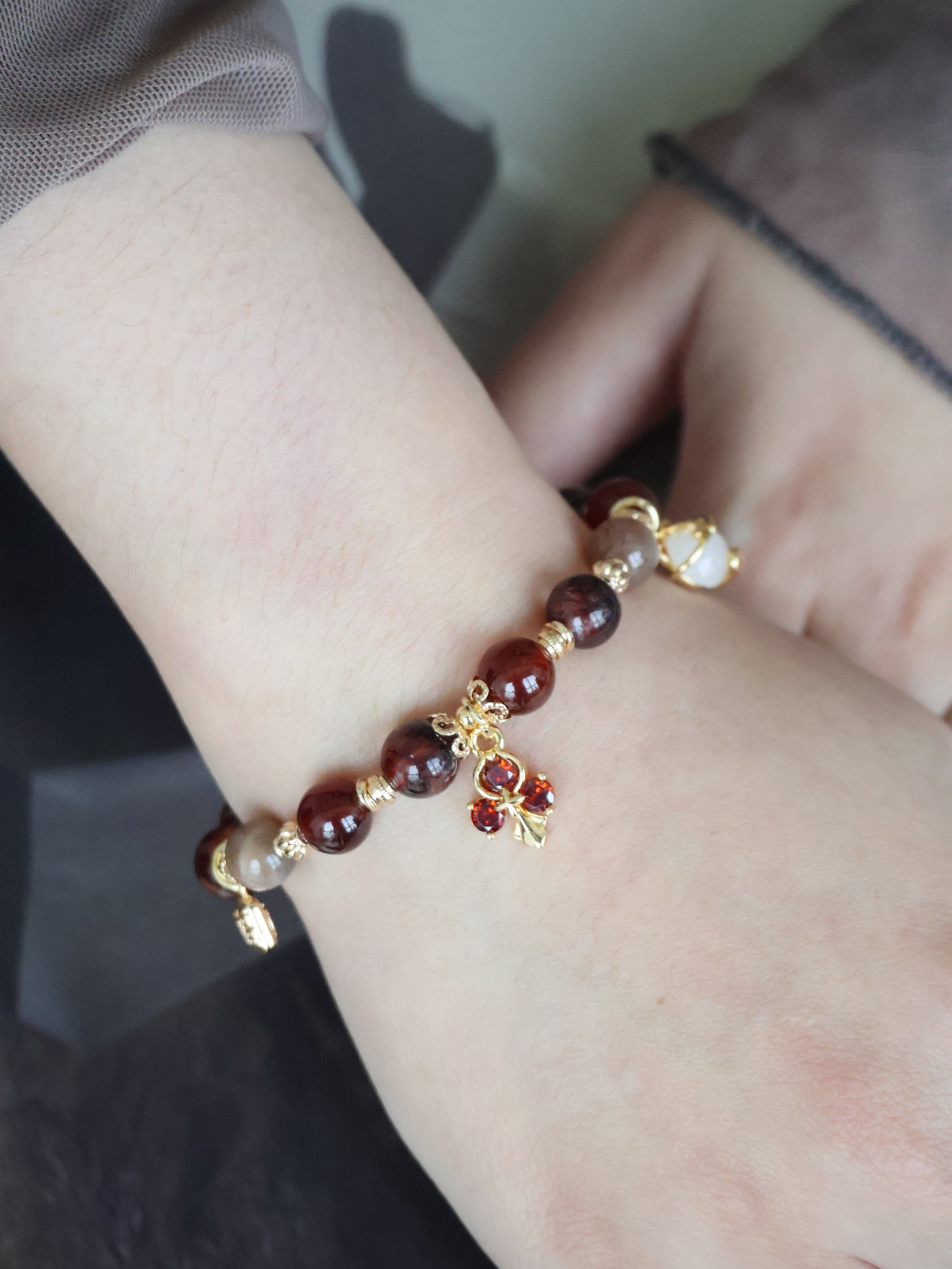 *Instocks* - Crimson Blessing - 8mm Fire Quartz, Garnet, Black Gold Skeletal Sunstone, 招财猫 Cat Charm, Red 3-Leaf Clover & 福 Charm (Elastic) Gold