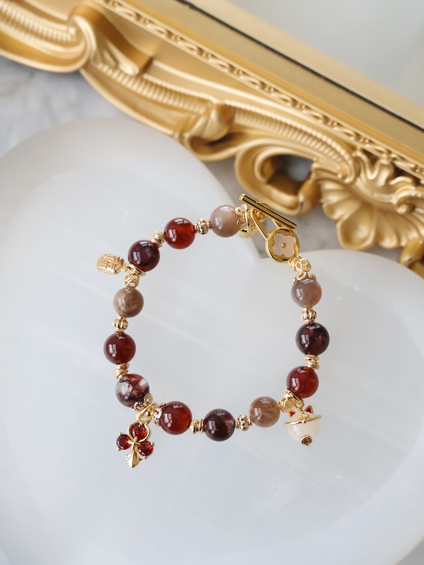 *Instocks* - Crimson Blessing - 8mm Fire Quartz, Garnet, Black Gold Skeletal Sunstone, 招财猫 Cat Charm, Red 3-Leaf Clover & 福 Charm (Elastic) Gold