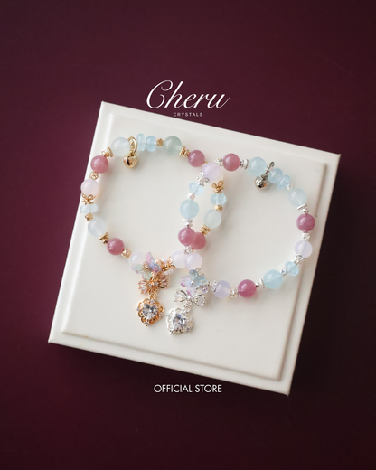 *Instocks*  -  Blossara - 8mm Blue Topaz, Aquamarine, Lilac Chalcedony & Lavender Rose Quartz with Dangly Sparkly Heart and Butterfly Rainbow Charm (Elastic)